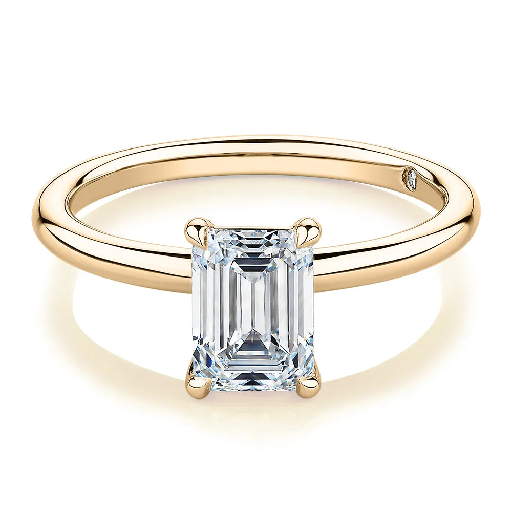 Signature Simulant Diamond 1.50 carat* emerald cut solitaire engagement ring in 14 carat yellow gold